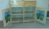 Living room cabinet with stain glass doors, looking inside